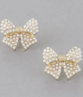 Bow stud Earrings with gold and pearl detail